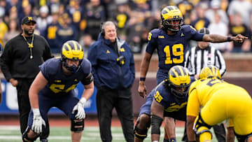 Michigan head coach Sherrone Moore, left, and associate head coach Biff Poggi watch quarterback Bryce Underwood (19) during the first half of the spring game at Michigan Stadium in Ann Arbor on Saturday, April 19, 2025.