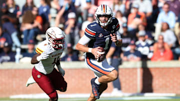 Nov 16, 2024; Auburn, Alabama, USA;  Louisiana Monroe Warhawks linebacker Travor Randle (4) chases Auburn Tigers quarterback Payton Thorne (1) during the third quarter at Jordan-Hare Stadium. Mandatory Credit: John Reed-Imagn Images