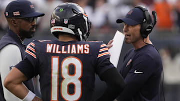 Sep 21, 2025; Chicago, Illinois, USA; Chicago Bears head coach Ben Johnson talks with quarterback Caleb Williams (18) against the Dallas Cowboys during the second half at Soldier Field. Mandatory Credit: David Banks-Imagn Images
