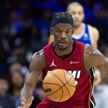 Apr 17, 2024; Philadelphia, Pennsylvania, USA; Miami Heat forward Jimmy Butler (22) picks up a loose ball against the Philadelphia 76ers during the second quarter of a play-in game of the 2024 NBA playoffs at Wells Fargo Center. Mandatory Credit: Bill Streicher-USA TODAY Sports