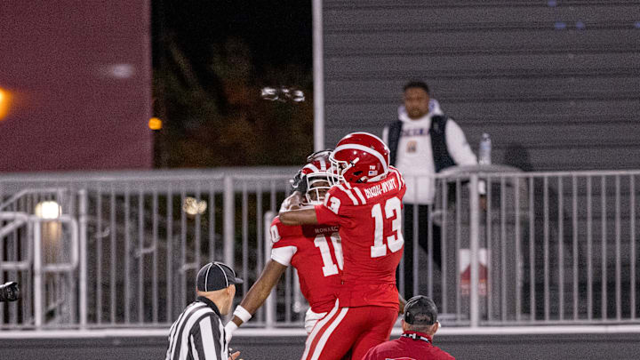 Kayden Dixon-Wyatt celebrates a touchdown with teammate Marcus Harris. National champions in 2025, they do a lot of celebrating at Mater Dei.