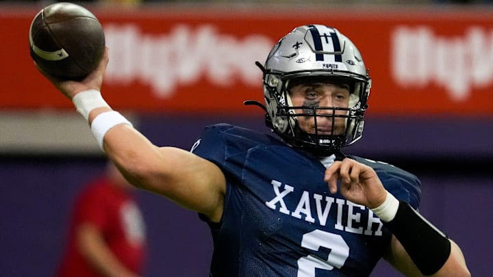 Xavier's Cash Parks (2) throws a pass Nov. 20, 2025 during the Class 4A state football championship against the Pella Dutch at the UNI-Dome in Cedar Falls, Iowa.