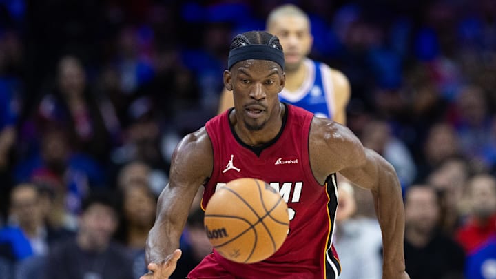 Apr 17, 2024; Philadelphia, Pennsylvania, USA; Miami Heat forward Jimmy Butler (22) picks up a loose ball against the Philadelphia 76ers during the second quarter of a play-in game of the 2024 NBA playoffs at Wells Fargo Center. Mandatory Credit: Bill Streicher-Imagn Images