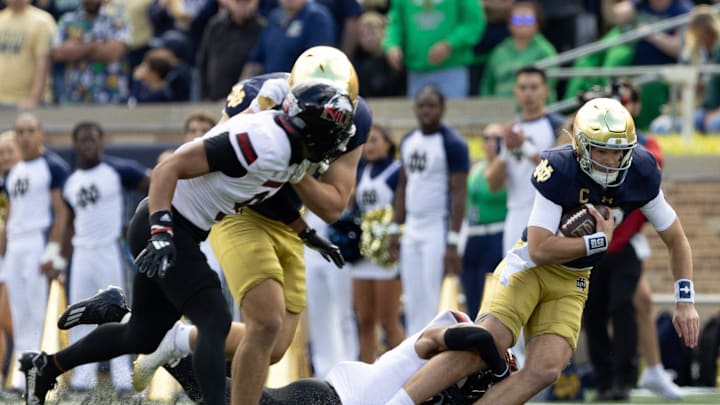 Northern Illinois safety Santana Banner tackles Notre Dame quarterback Riley Leonard during a NCAA college football game between Notre Dame and Northern Illinois at Notre Dame Stadium on Saturday, Sept. 7, 2024, in South Bend.