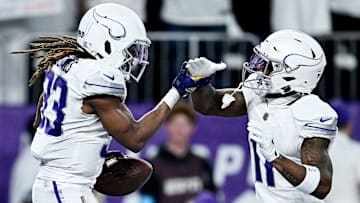 Minnesota Vikings RB Aaron Jones (33) and WR Trent Sherfield (11)