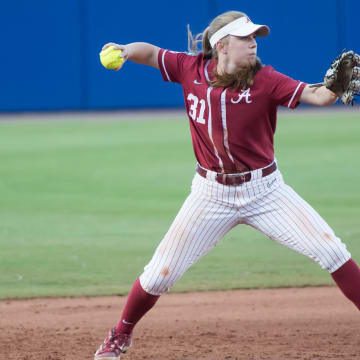 May 31, 2024; Oklahoma City, OK, USA;  Alabama Crimson Tide infielder Kenleigh Cahalan (31) throws to first base in  the sixth inning against the Duke Blue Devils during a Women's College World Series softball losers bracket elimination game at Devon Park. Mandatory Credit: Brett Rojo-USA TODAY Sports
