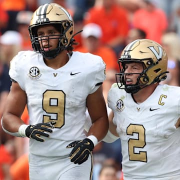 Nov 2, 2024; Auburn, Alabama, USA;  Vanderbilt Commodores quarterback Diego Pavia (2) celebrates with tight end Eli Stowers (9) after a touchdown during the fourth quarter against the Auburn Tigers at Jordan-Hare Stadium. Mandatory Credit: John Reed-Imagn Images