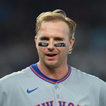 Sep 28, 2025; Miami, Florida, USA; New York Mets first baseman Pete Alonso (20) reacts while standing next to shortstop Francisco Lindor (12) after his at bat against the Miami Marlins during the fifth inning at loanDepot Park. Mandatory Credit: Sam Navarro-Imagn Images