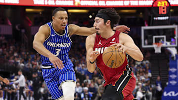 Dec 5, 2025; Orlando, Florida, USA; Miami Heat forward Jaime Jaquez Jr. (11) drives to the basket past Orlando Magic guard Desmond Bane (3) in the first quarter at Kia Center. Mandatory Credit: Nathan Ray Seebeck-Imagn Images