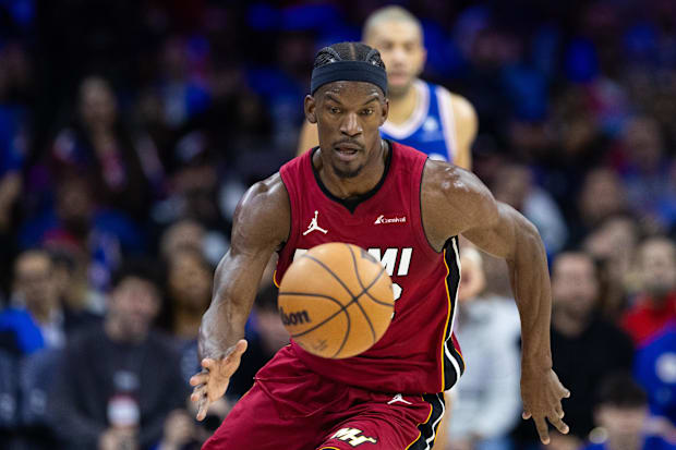 Miami Heat forward Jimmy Butler (22) picks up a loose ball against the Philadelphia 76ers during the 2024 NBA playoffs.