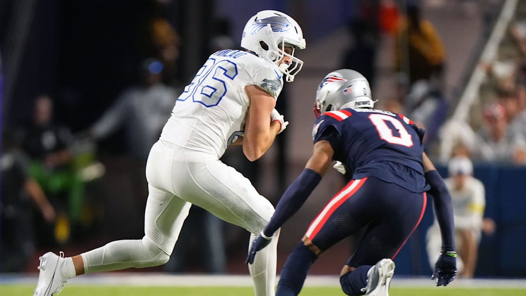 Oct 5, 2025; Orchard Park, NY; Dalton Kincaid  makes a catch against Patriots cornerback Christian Gonzalez