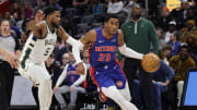 Jan 20, 2024; Detroit, Michigan, USA;  Detroit Pistons guard Jaden Ivey (23) dribbles on Milwaukee Bucks guard Malik Beasley (5) in the first half at Little Caesars Arena. Mandatory Credit: Rick Osentoski-USA TODAY Sports