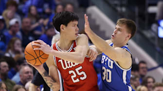 Former Utah Utes guard Mike Sharavjamts (25) and former BYU Cougars guard Dallin Hall (30) are among players from the Big 12 who've enter the transfer portal this offseason.