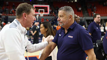 Jan 4, 2025; Auburn, Alabama, USA;  Auburn Tigers athletic director John Cohen congratulates Bruce Pearl after beating the Missouri Tigers at Neville Arena. Pearl now has 213 wins at Auburn and is tied with Joel Eaves as the winningest coach in Auburn history. Mandatory Credit: John Reed-Imagn Images