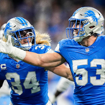 Detroit Lions linebacker Trevor Nowaske (53), center, celebrates an interception against Tennessee Titans during the first half at Ford Field in Detroit on Sunday, Oct. 27, 2024.