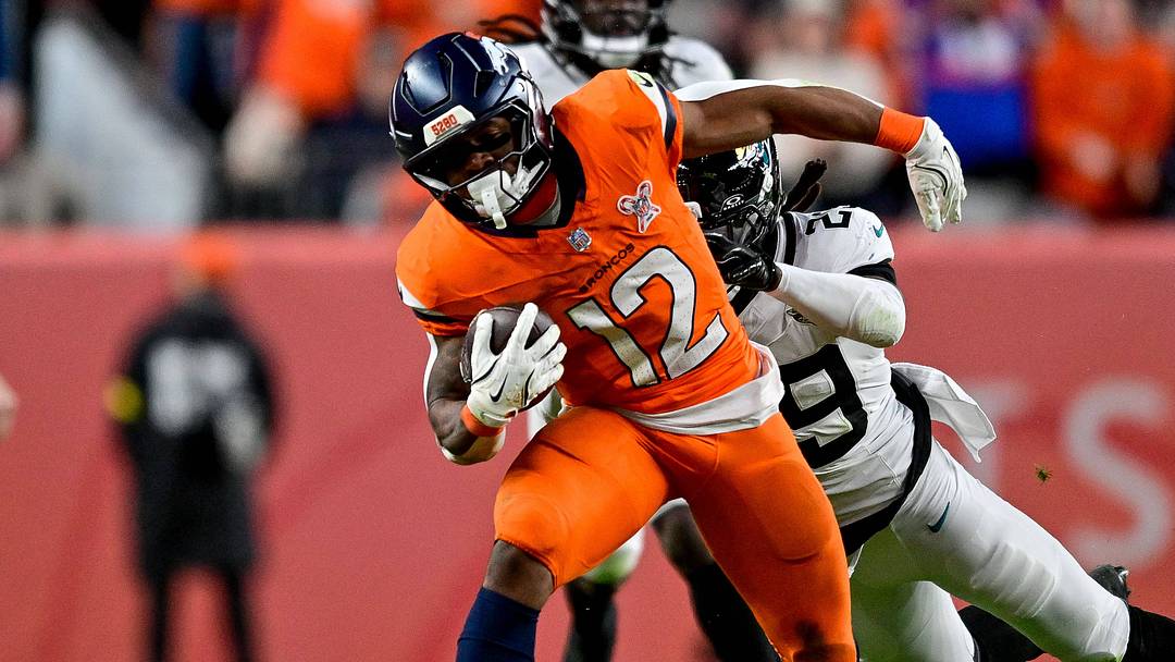 DENVER, CO - DECEMBER 21: Denver Broncos running back RJ Harvey (12) runs after a catch in the fourth quarter during a game between the Jacksonville Jaguars and the Denver Broncos at Empower Field at Mile High on December 21, 2025 in Denver, Colorado. 