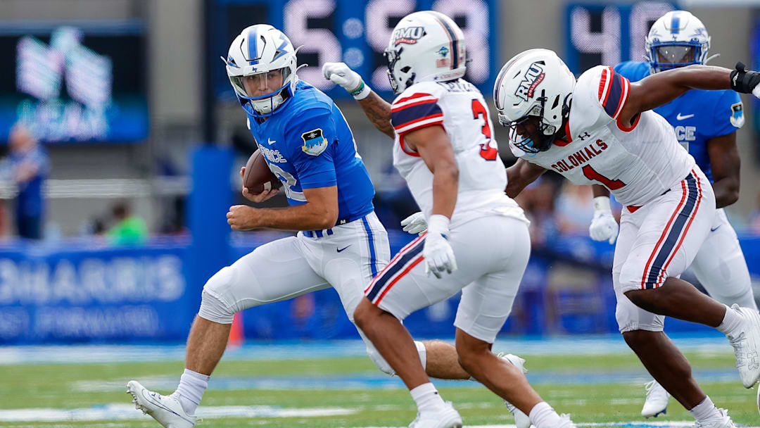 Sep 2, 2023; Colorado Springs, Colorado, USA; Air Force Falcons quarterback John Busha (12) runs the ball against Robert Morris Colonials defensive back Robert Carter Jr. (3) and linebacker Jamar Shegog (1) in the fourth quarter at Falcon Stadium. Mandatory Credit: Isaiah J. Downing-Imagn Images