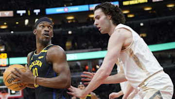 Feb 8, 2025; Chicago, Illinois, USA; Chicago Bulls guard Josh Giddey (3) defends Golden State Warriors forward Jimmy Butler (10) during the first half at United Center. Mandatory Credit: David Banks-Imagn Images