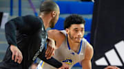 Delaware's Izaiah Pasha (right) pushes the ball to the Hens' end against William and Mary's Caleb Dorsey in the second half of the Blue Hens' 74-64 win at the Bob Carpenter Center, Saturday, Feb. 8, 2025.