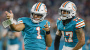 Jan 9, 2022; Miami Gardens, Florida, USA; Miami Dolphins quarterback Tua Tagovailoa (1) reacts with