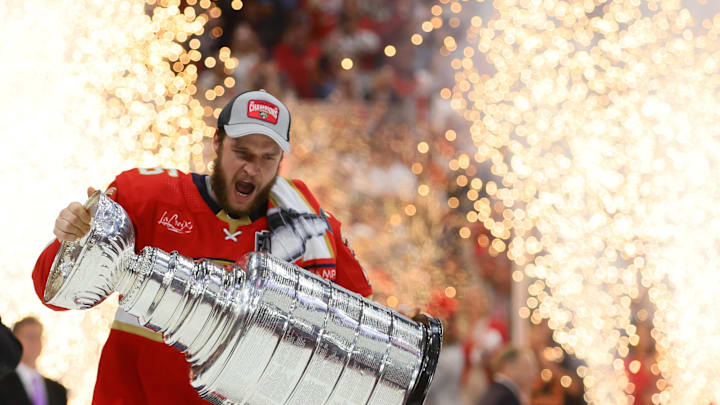 Jun 24, 2024; Sunrise, Florida, USA; Florida Panthers forward Aleksander Barkov (16) hoists the Stanley Cup  after defeating the Edmonton Oilers in game seven of the 2024 Stanley Cup Final at Amerant Bank Arena. Mandatory Credit: Sam Navarro-Imagn Images
