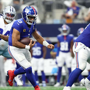 New York Giants quarterback Russell Wilson runs with the ball against the Dallas Cowboys.