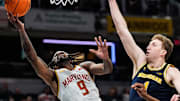 Maryland guard Selton Miguel (9) goes to the basket against Michigan center Danny Wolf (1) during the second half of Big Ten Tournament semifinal at Gainbridge Fieldhouse in Indianapolis, Ind. on Saturday, March 15, 2025.