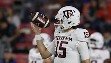 Nov 23, 2024; Auburn, Alabama, USA;  Texas A&M Aggies quarterback Conner Weigman (15) warms up before the game against the Auburn Tigers at Jordan-Hare Stadium. Mandatory Credit: John Reed-Imagn Images