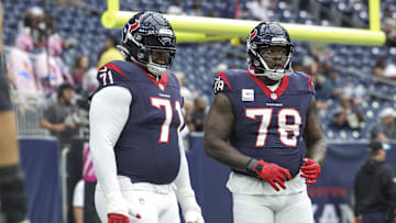 Oct 15, 2023; Houston, Texas, USA; Houston Texans offensive tackle Tytus Howard (71) and offensive tackle Laremy Tunsil (78) warm up before the game against the New Orleans Saints at NRG Stadium. Mandatory Credit: Troy Taormina-Imagn Images
