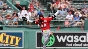 Jul 2, 2025; Boston, MA, USA; Cincinnati Reds shortstop Elly De La Cruz (44) attempts to catch a pop fly during the sixth inning against the Boston Red Sox at Fenway Park. Mandatory Credit: Paul Rutherford-Imagn Images
