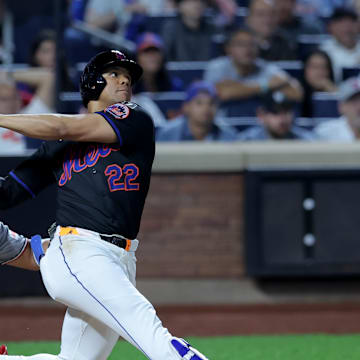 Sep 19, 2025; New York City, New York, USA; New York Mets right fielder Juan Soto (22) follows through on a three run home run against the Washington Nationals during the fourth inning at Citi Field. Mandatory Credit: Brad Penner-Imagn Images