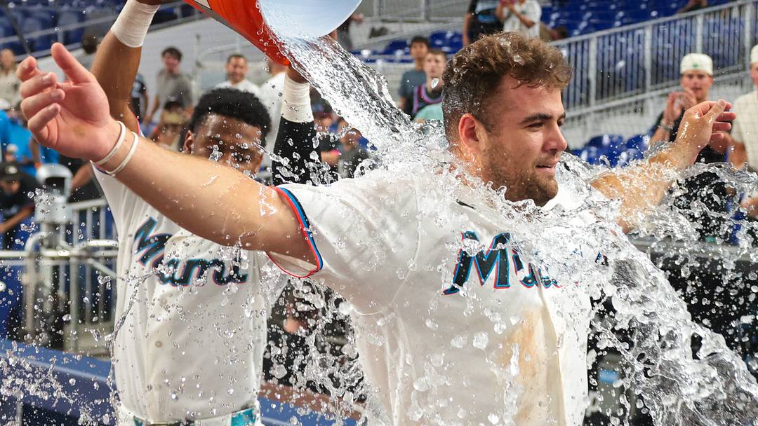 Marlins center fielder Jakob Marsee (87) is doused with water by shortstop Otto Lopez (6) after hitting a walk-off single