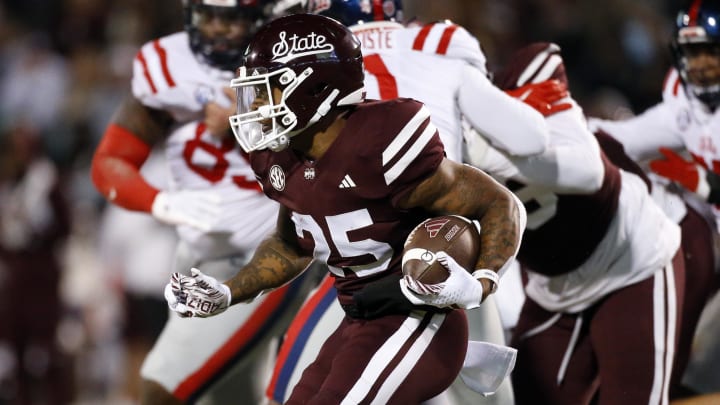 Nov 23, 2023; Starkville, Mississippi, USA; Mississippi State Bulldogs running back Jeffery Pittman (25) runs the ball during the first half against the Mississippi Rebels at Davis Wade Stadium at Scott Field. Mandatory Credit: Petre Thomas-USA TODAY Sports