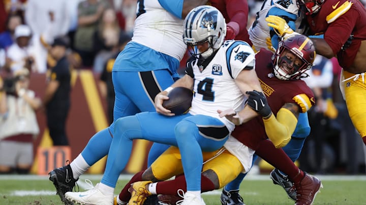 Carolina Panthers quarterback Andy Dalton is sacked by Washington Commanders linebacker Frankie Luvu. Carolina Panthers quarterback Andy Dalton is sacked by Washington Commanders linebacker Frankie Luvu.
