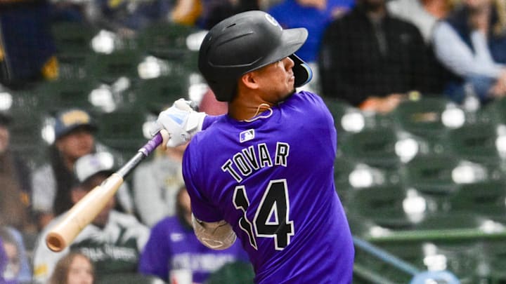 Sep 6, 2024; Milwaukee, Wisconsin, USA;  Colorado Rockies shortstop Ezequiel Tovar (14) hits a double in the sixth inning against the Milwaukee Brewers at American Family Field.