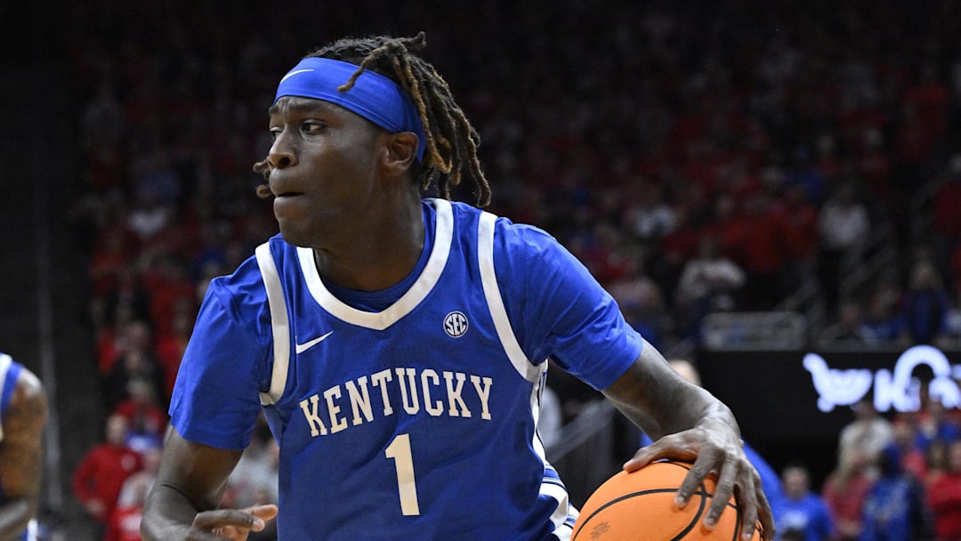 Nov 11, 2025; Louisville, Kentucky, USA; Kentucky Wildcats guard Denzel Aberdeen (1) dribbles against the Louisville Cardinals during the first half at KFC Yum! Center. Louisville defeated Kentucky 96-88. Mandatory Credit: Jamie Rhodes-Imagn Images Nov 11, 2025; Louisville, Kentucky, USA; Kentucky Wildcats guard Denzel Aberdeen (1) dribbles against the Louisville Cardinals during the first half at KFC Yum! Center. Louisville defeated Kentucky 96-88. Mandatory Credit: Jamie Rhodes-Imagn Images