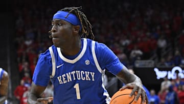 Nov 11, 2025; Louisville, Kentucky, USA; Kentucky Wildcats guard Denzel Aberdeen (1) dribbles against the Louisville Cardinals during the first half at KFC Yum! Center. Louisville defeated Kentucky 96-88. Mandatory Credit: Jamie Rhodes-Imagn Images
