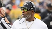 Nov 8, 2025; Morgantown, West Virginia, USA; Colorado Buffaloes head coach Deion Sanders walks along the sidelines late in the fourth quarter against the West Virginia Mountaineers at Milan Puskar Stadium. Mandatory Credit: Ben Queen-Imagn Images