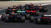 Sergio Perez of Mexico driving the (11) Oracle Red Bull Racing RB19 and Valtteri Bottas of Finland driving the (77) Alfa Romeo F1 C43 Ferrari battle for track position during the F1 Grand Prix of Hungary at Hungaroring on July 23, 2023 in Budapest, Hungary. (Photo by Mark Thompson/Getty Images)