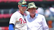 May 22, 2022; Philadelphia, Pennsylvania, USA; Philadelphia Phillies Hall of Fame third baseman Mike Schmidt and first baseman Rhys Hoskins (17) after throwing out the first pitch against the Los Angeles Dodgers at Citizens Bank Park. 