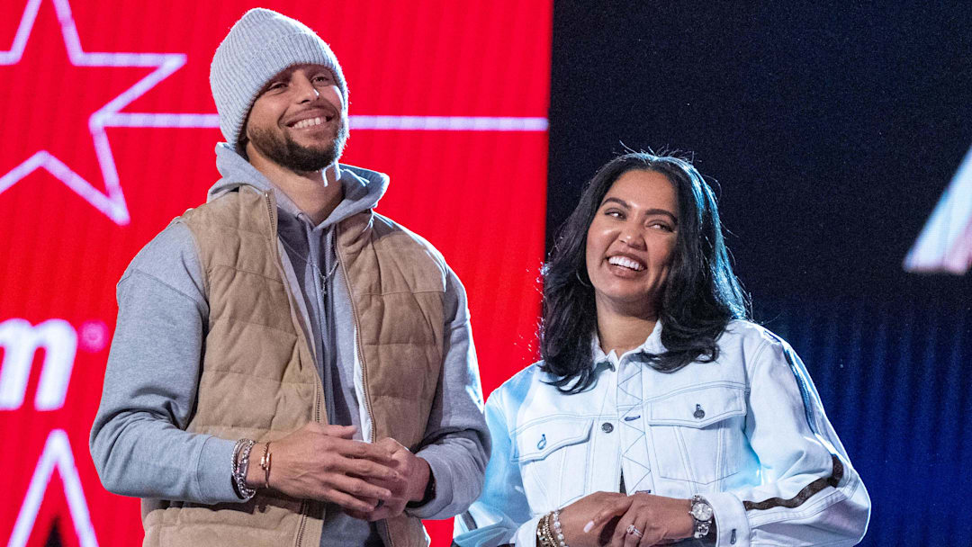 February 19, 2022; Cleveland, OH, USA; Golden State Warriors guard Stephen Curry (30) and wife Ayesha Curry (right) during the 2022 NBA All-Star Saturday Night at Rocket Mortgage Field House. Mandatory Credit: Kyle Terada-Imagn Images