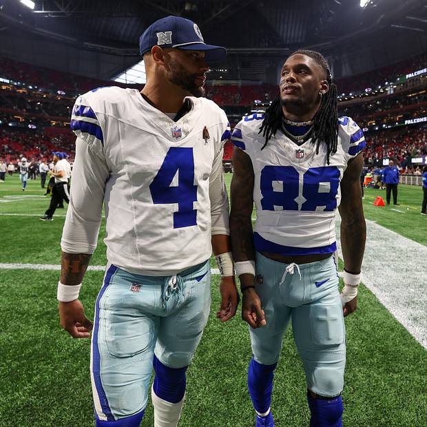 Dallas Cowboys stars Dak Prescott and CeeDee Lamb walk off the field after a loss against the Atlanta Falcons