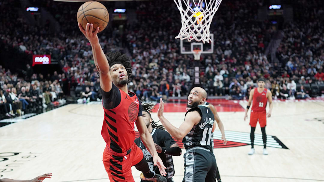 Apr 6, 2025; Portland, Oregon, USA; Portland Trail Blazers shooting guard Shaedon Sharpe (17) lays up a shot during the second half against the San Antonio Spurs at Moda Center. Mandatory Credit: Soobum Im-Imagn Images