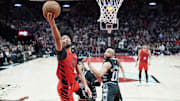 Apr 6, 2025; Portland, Oregon, USA; Portland Trail Blazers shooting guard Shaedon Sharpe (17) lays up a shot during the second half against the San Antonio Spurs at Moda Center. Mandatory Credit: Soobum Im-Imagn Images
