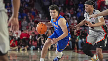 Feb 25, 2025; Athens, Georgia, USA; Florida Gators guard Walter Clayton Jr. (1) dribbles past Georgia Bulldogs guard Tyrin Lawrence (7) during the second half at Stegeman Coliseum. Mandatory Credit: Dale Zanine-Imagn Images