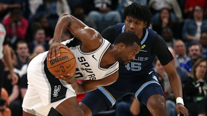 Feb 3, 2025; Memphis, Tennessee, USA; San Antonio Spurs forward Harrison Barnes (40) handles the ball as Memphis Grizzlies forward GG Jackson II (45) defends during the second quarter at FedExForum. Mandatory Credit: Petre Thomas-Imagn Images