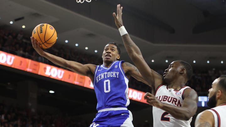 Feb 17, 2024; Auburn, Alabama, USA; Kentucky Wildcats guard Rob Dillingham (0) gets past Auburn Tigers forward Jaylin Williams (2) for a shot during the first half at Neville Arena. Mandatory Credit: John Reed-USA TODAY Sports