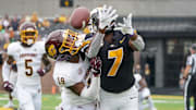 Sep 4, 2021; Columbia, Missouri, USA; Central Michigan Chippewas defensive back Donte Kent (19) breaks up a pass intended for Missouri Tigers wide receiver Dominic Lovett (7) during the first half at Faurot Field at Memorial Stadium. Mandatory Credit: Denny Medley-Imagn Images