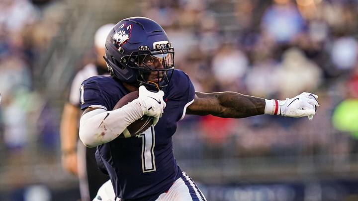 Sep 20, 2025; East Hartford, Connecticut, USA; Connecticut Huskies wide receiver Skyler Bell (1) runs the ball against et Ball State Cardinals in the second half at Pratt & Whitney Stadium at Rentschler Field. Mandatory Credit: David Butler II-Imagn Images