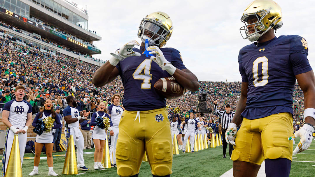 Notre Dame running back Jeremiyah Love (4) makes a heart sign after scoring a touchdown in the first half of a NCAA football game against Syracuse at Notre Dame Stadium on Saturday, Nov. 22, 2025, in South Bend.